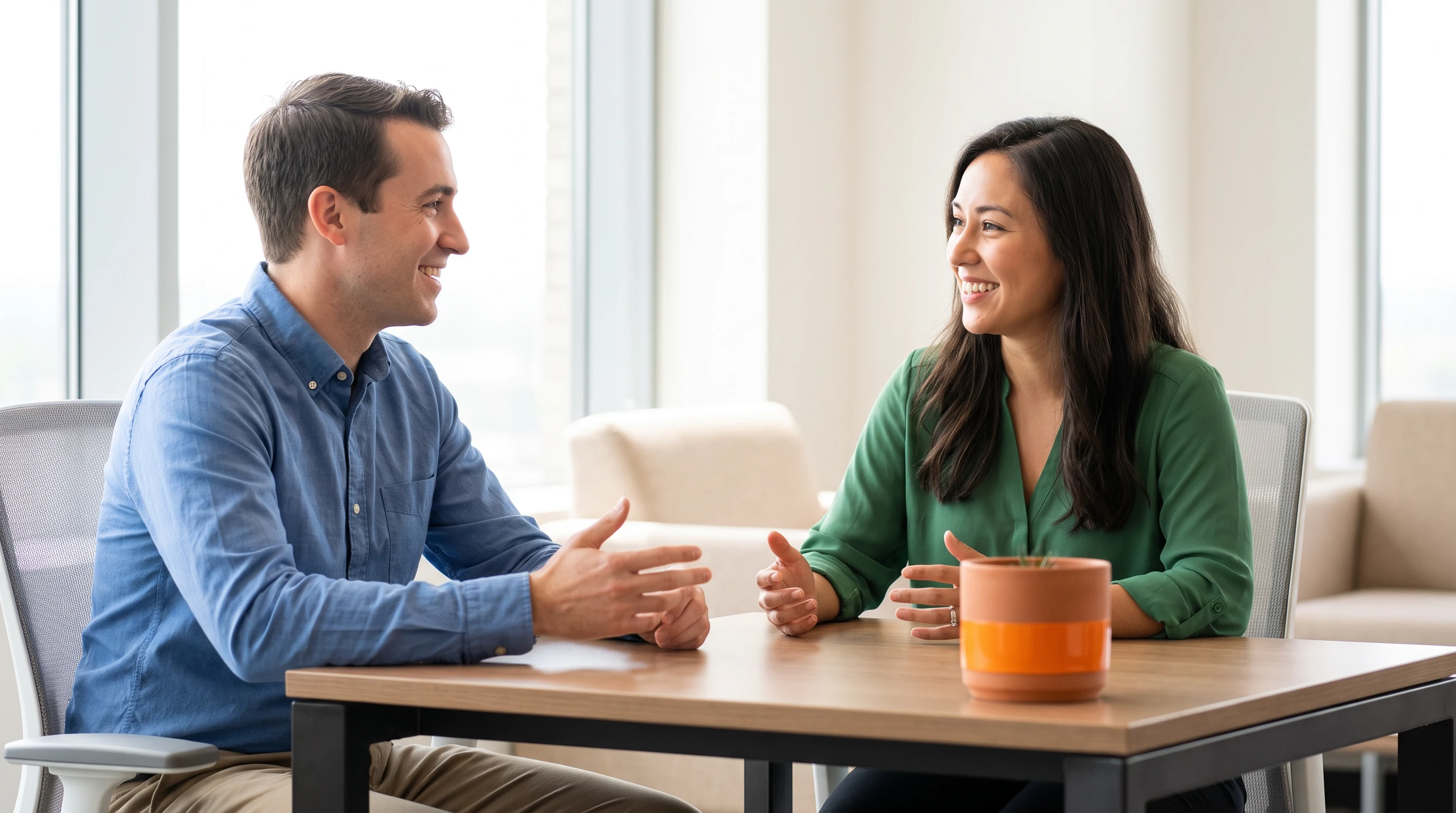 Two colleagues discussing an Azure architecture diagram printout during a technical interview
