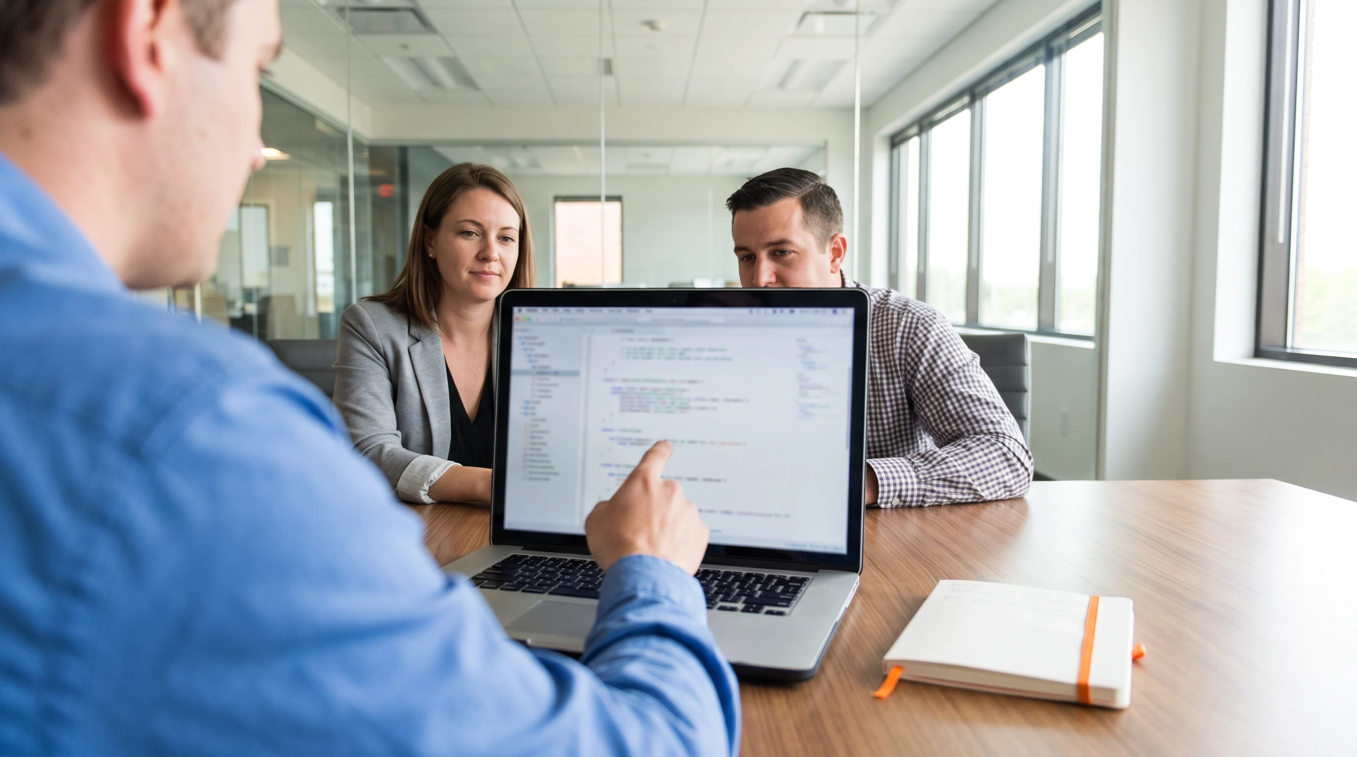 Azure engineer candidate walking an interviewer through a Bicep template on screen, over the shoulder framing