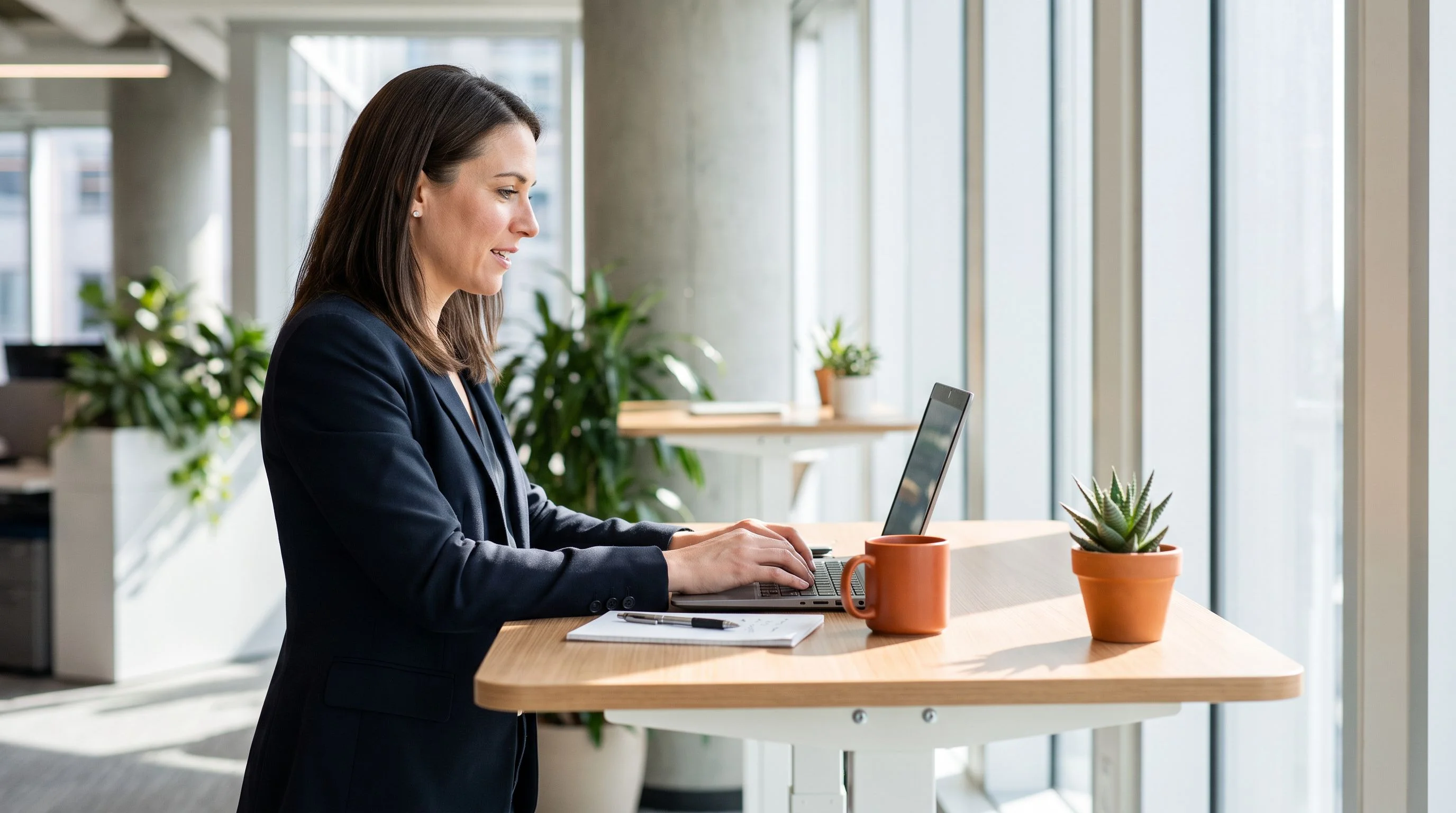 HR professional reviewing printed job description documents at a modern desk