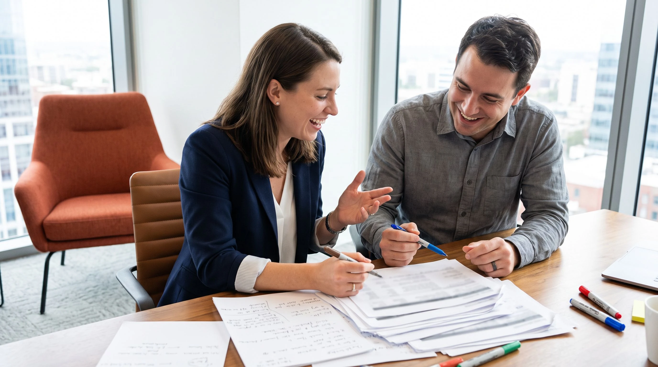 Recruiter and engineering manager reviewing AI engineer job posting sections on a shared screen in a conference room