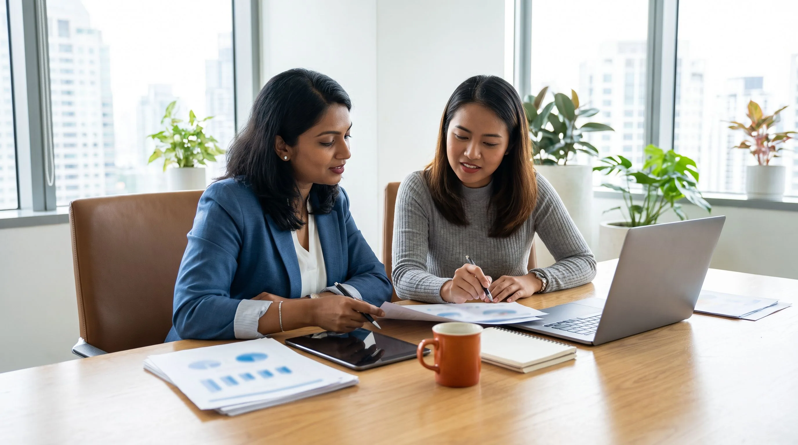 HR manager writing customer support representative job description at a modern desk with orange coffee mug