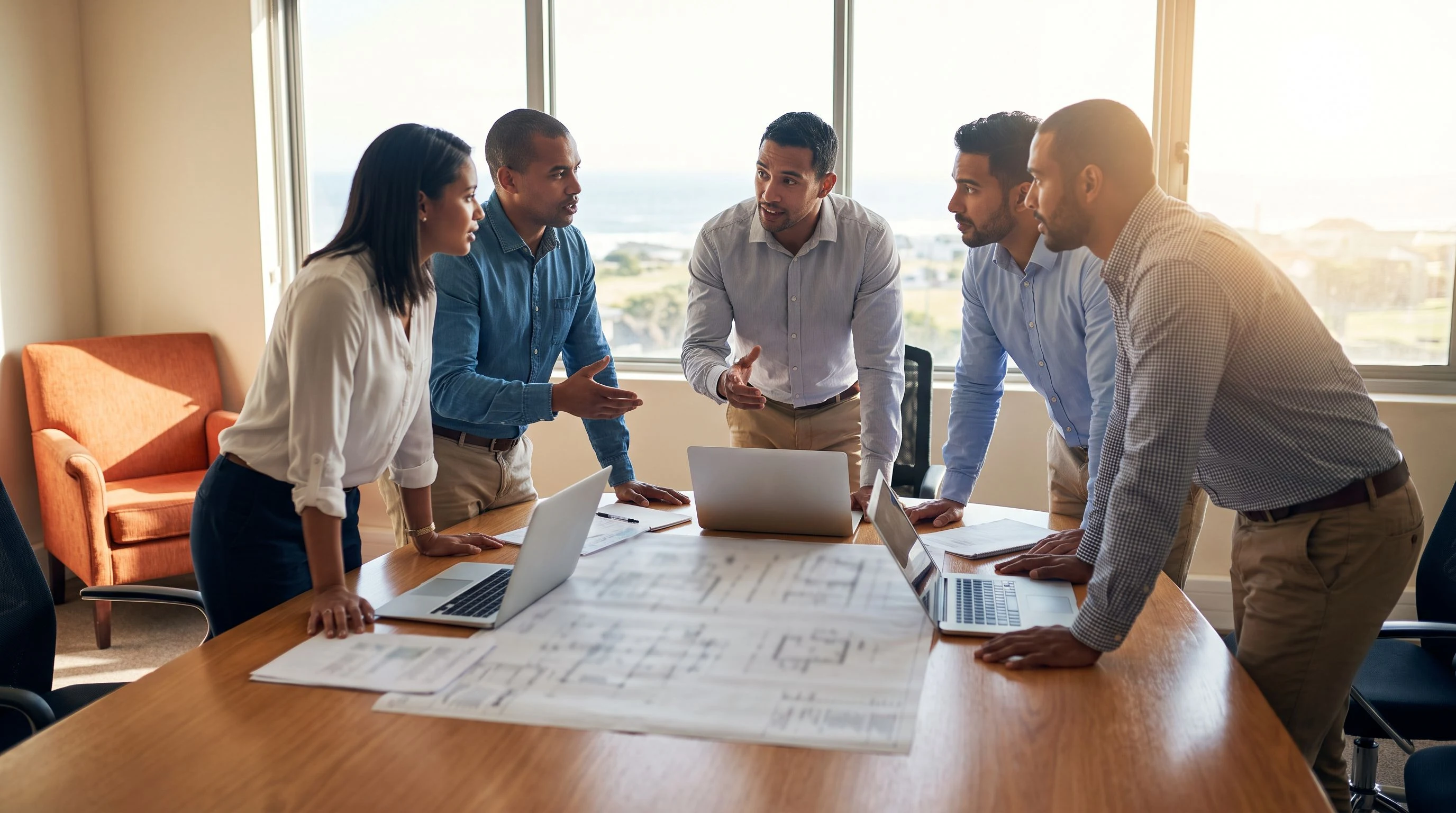 Hiring manager on a video call with a nearshore AI engineer candidate, modern office, orange accent water bottle on desk