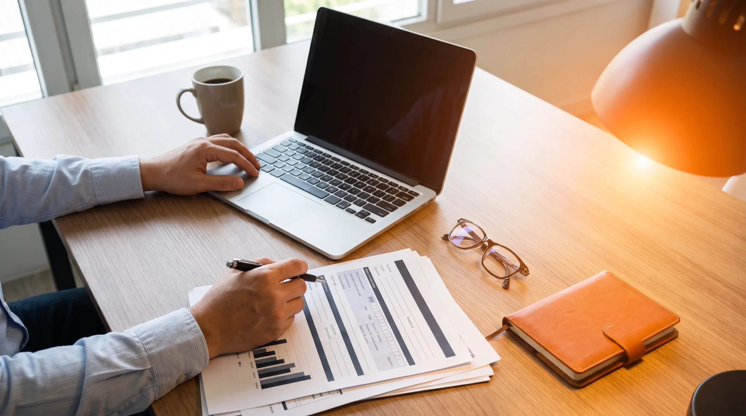 Offshore hiring compliance and payroll documents being reviewed in an office