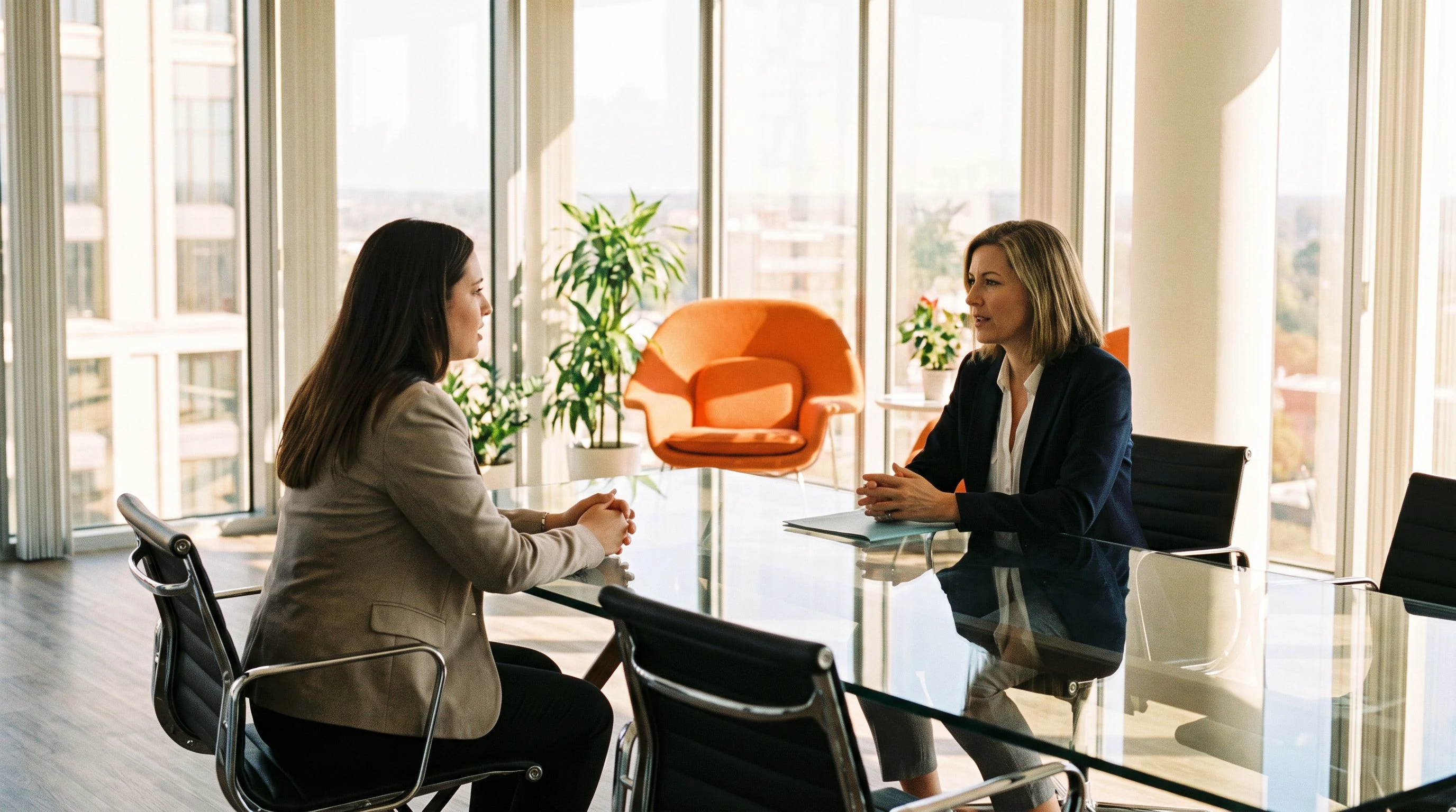 HR interviewer reviewing structured evaluation scorecard with candidate notes in a professional office setting