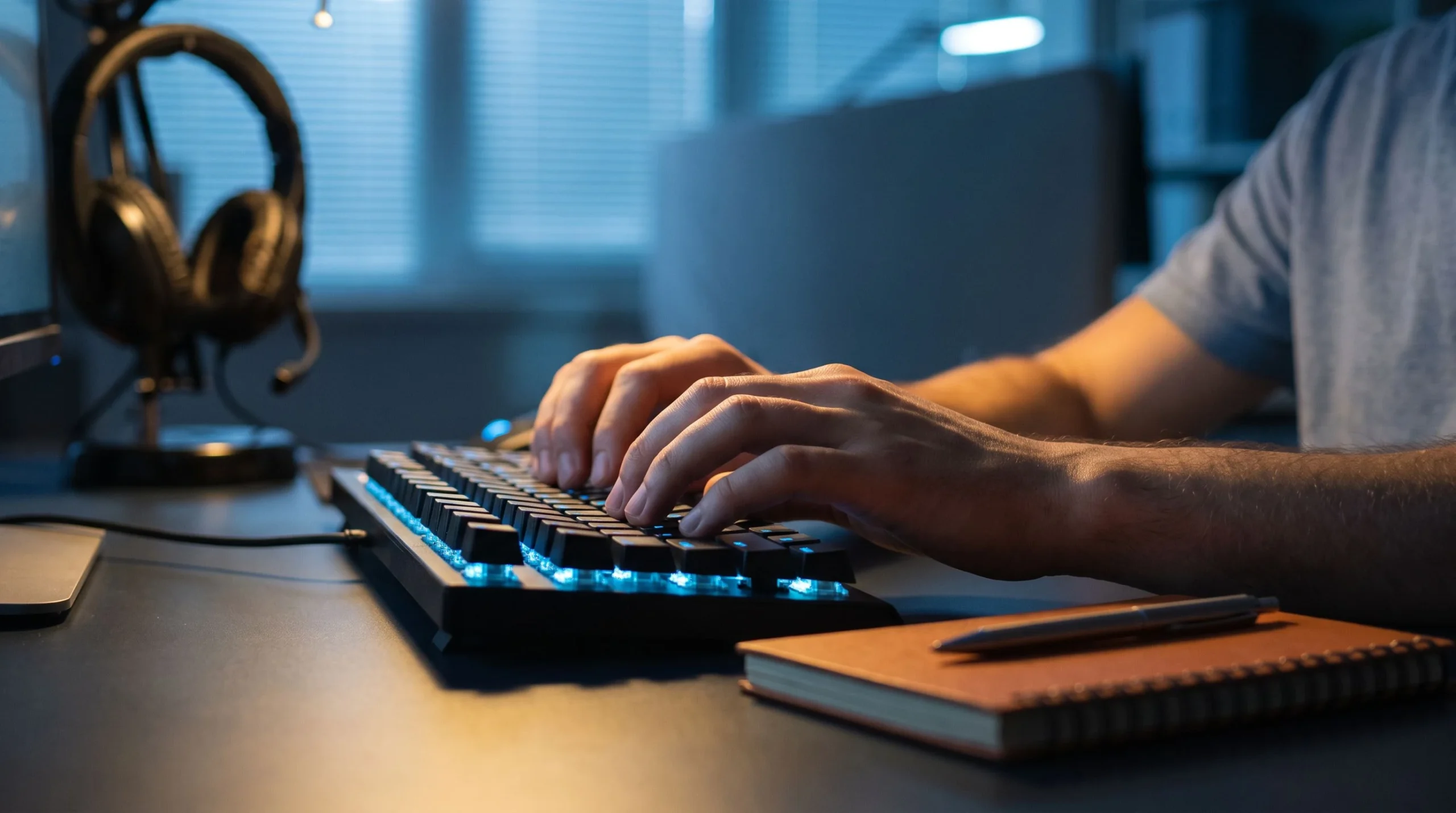 Outsourced customer support agent typing during 24/7 night shift ticket coverage