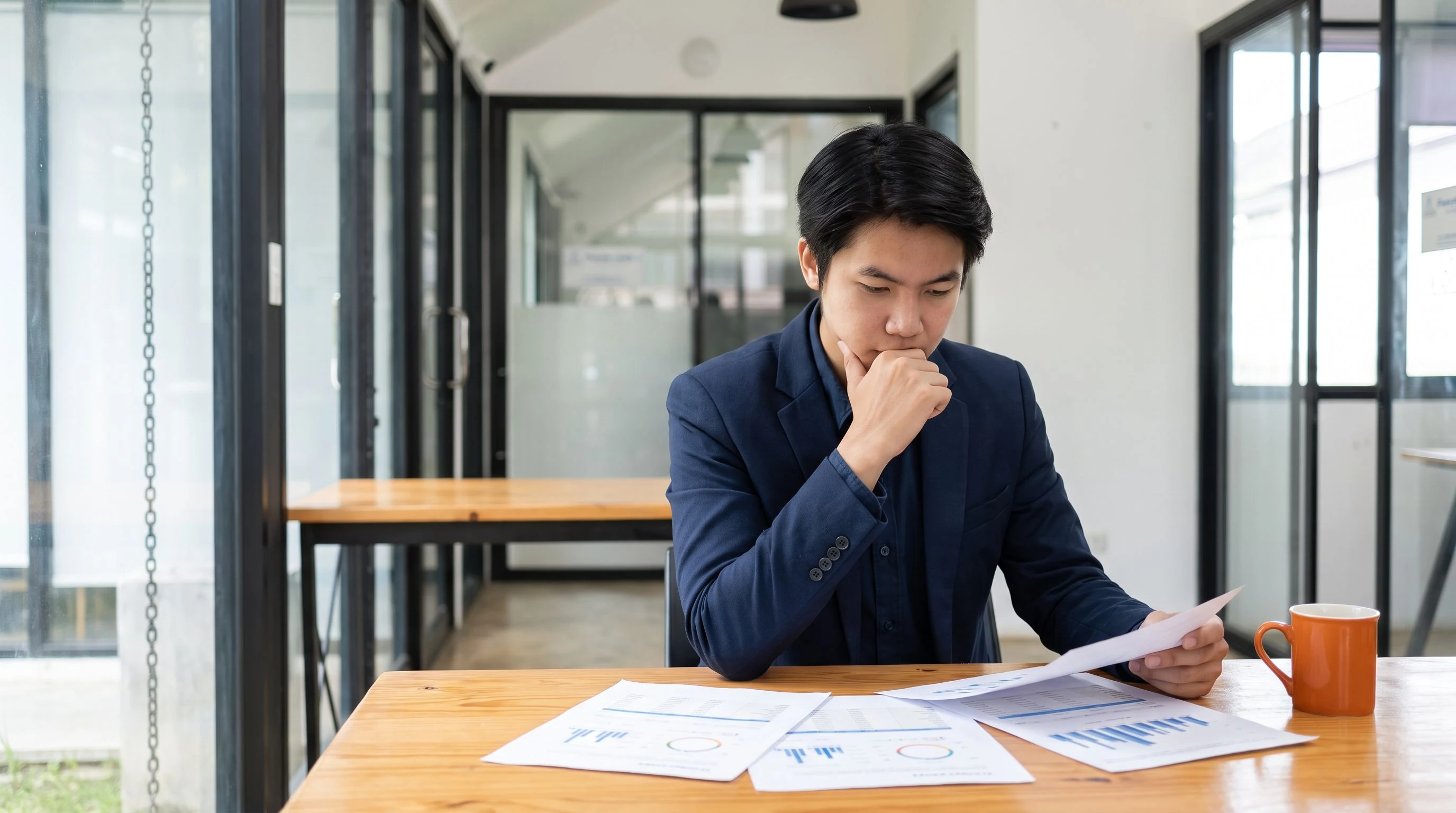 Offshore appointment setter reviewing CRM pipeline and call list at a professional workspace