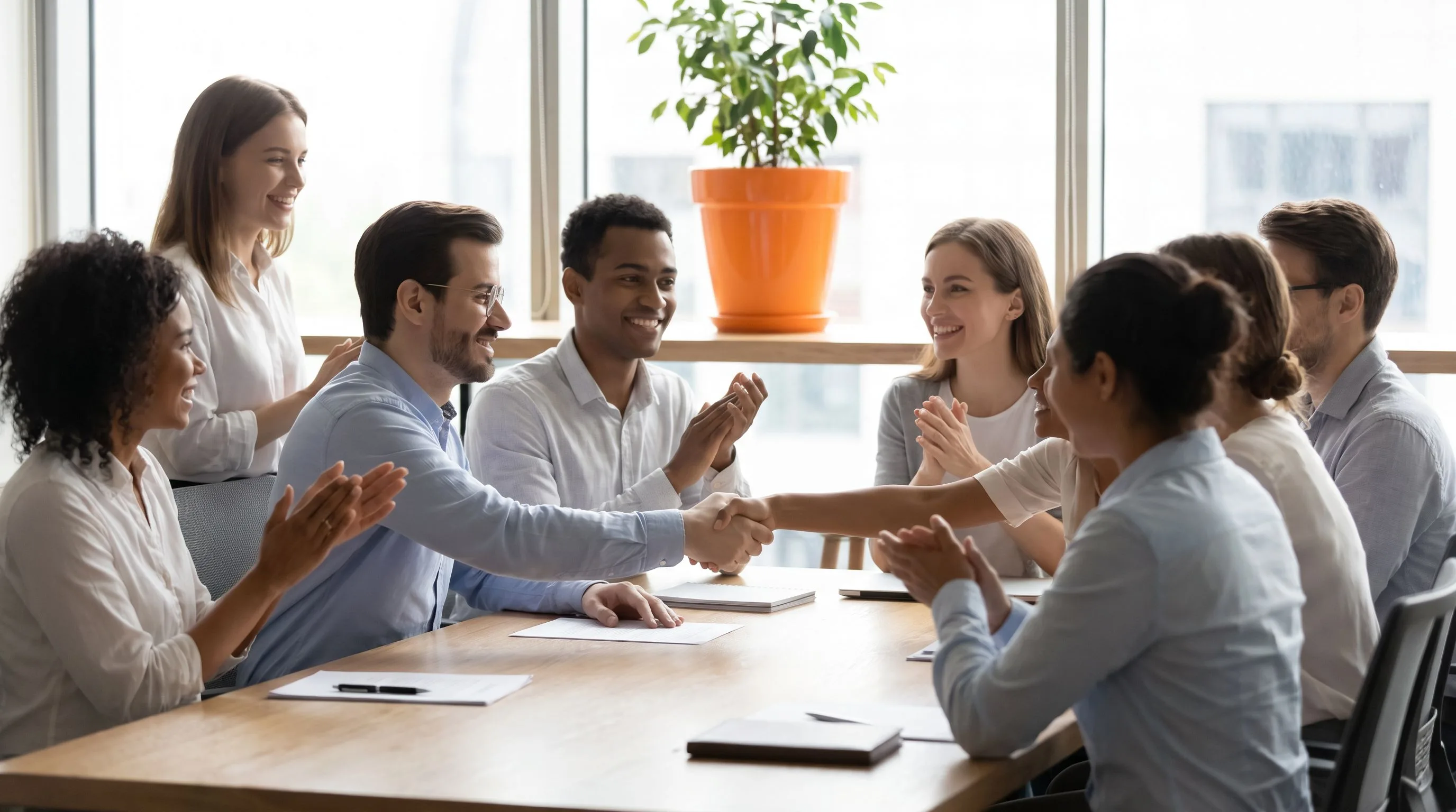 US manager onboarding new nearshore hire during video call with team collaboration