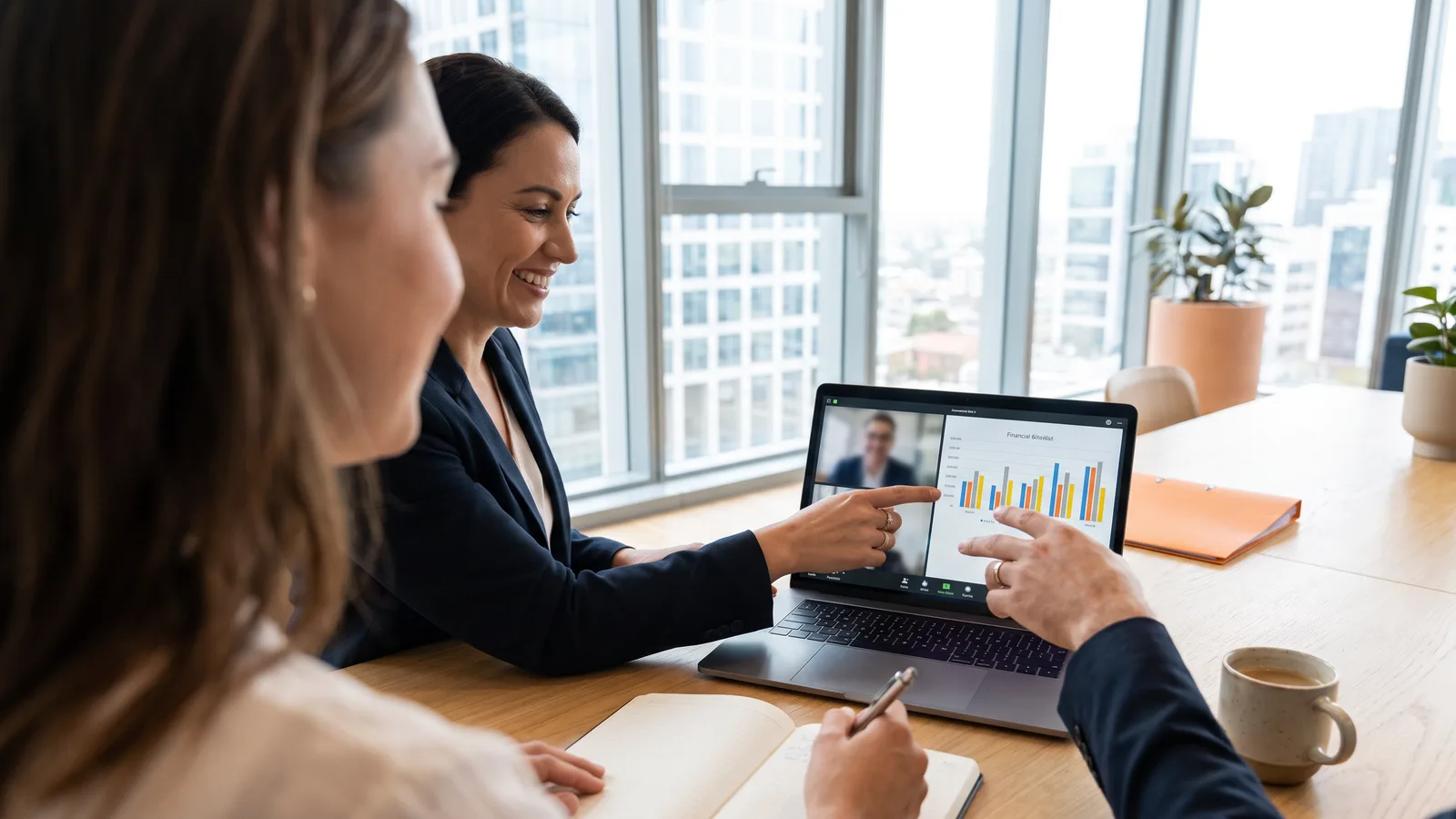 Finance team reviewing financial charts together after adding offshore F&A support