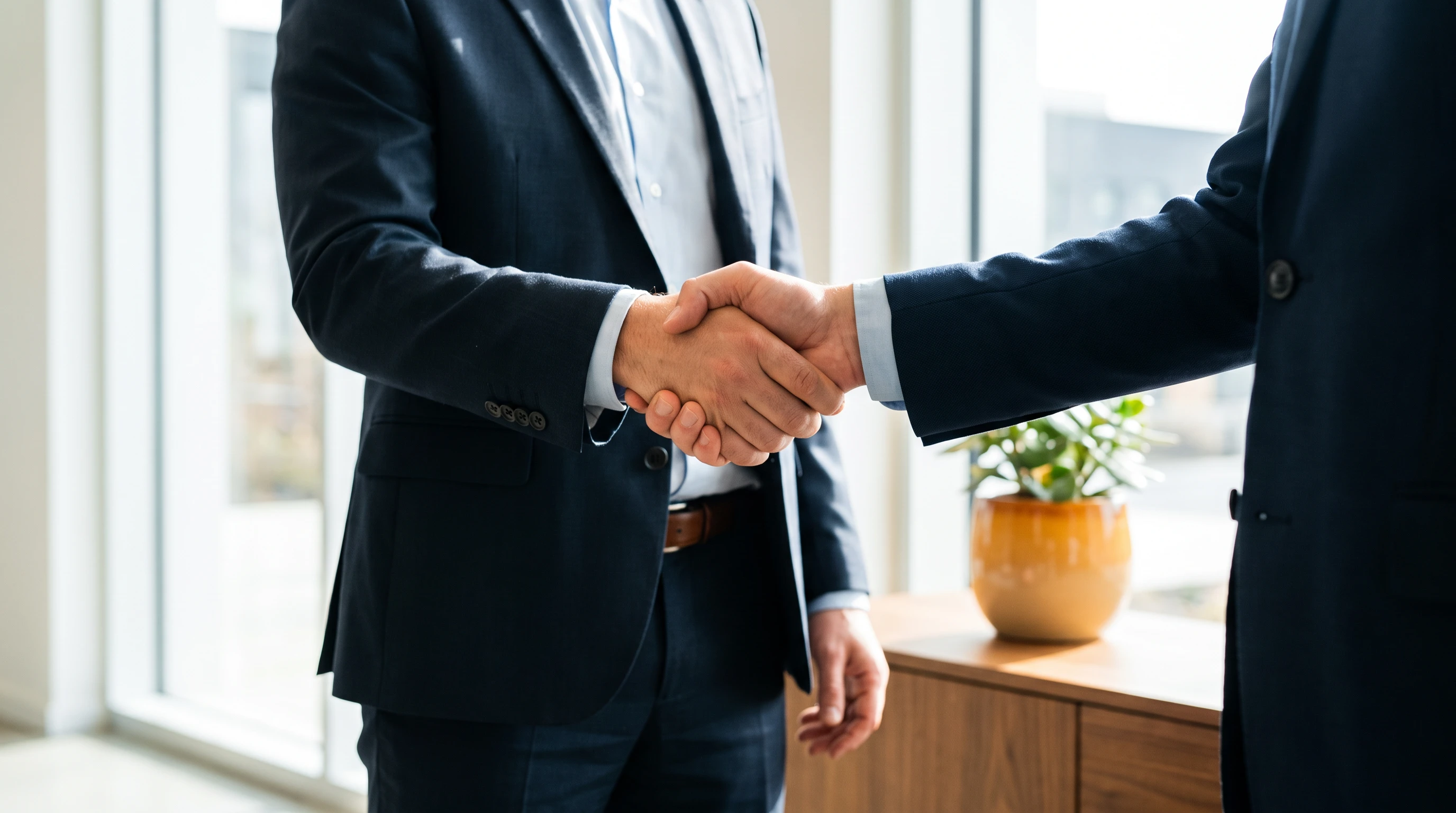 Professional handshake closing a successful hire in a modern office