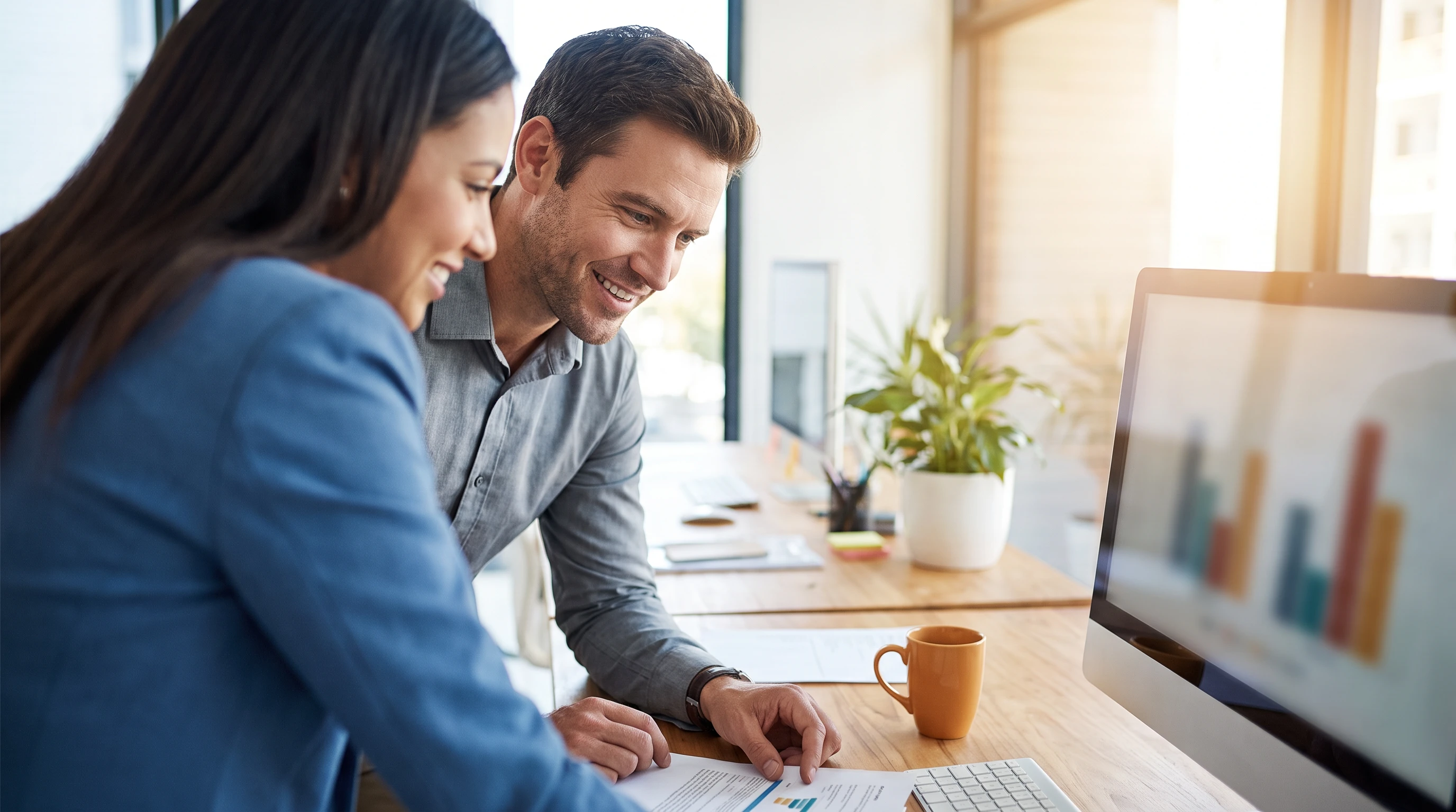 Small business owner reviewing bookkeeping reports with a dedicated Kore BPO bookkeeping specialist
