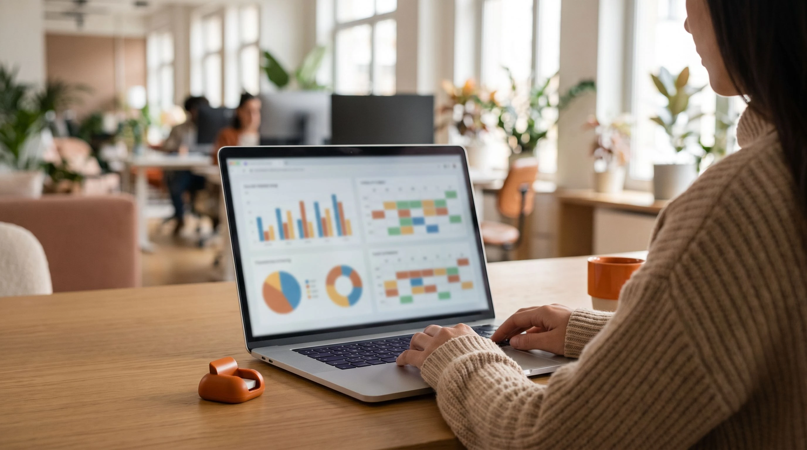 Social media manager reviewing a content calendar and analytics dashboard, illustrating outsourced social media management outsourcing pricing